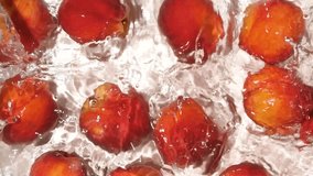 Top View of Ripe Peaches Floating in Water with Ripples Slow Motion - Powered by Shutterstock - Get 15% off with code: PIKWIZARD15