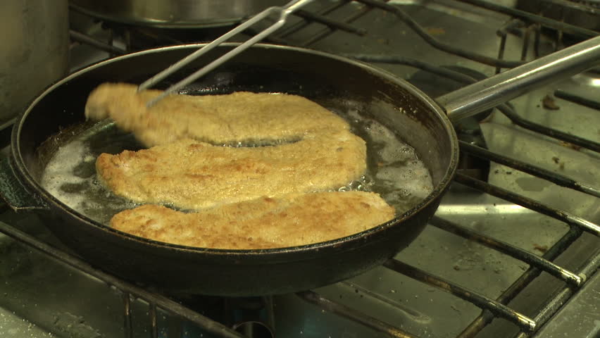 Turning over Schnitzel / Chip in pan