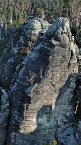Aerial view of Teplice Rocks, part of Adrspach-Teplice landscape mountain park in Broumov highlands region of Bohemia, Czech Republic. Vertical video