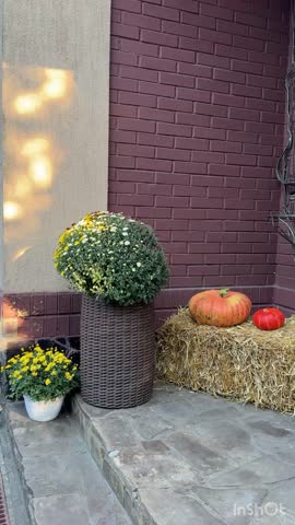 Fall porch decor with pumpkins, hay bale and chrysanthemums - dolly in or out video for seasonal promos