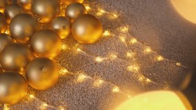 The scene showcases shining golden Christmas ornaments intertwined with twinkling lights on a soft surface, creating a warm atmosphere filled with joyous holiday cheer and festive spirit - Powered by Shutterstock - Get 15% off with code: PIKWIZARD15