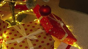 A cozy holiday scene with beautifully wrapped Christmas presents, colorful ribbons, and soft, glowing fairy lights, creating a warm and joyful atmosphere that evokes the holiday spirit - Powered by Shutterstock - Get 15% off with code: PIKWIZARD15