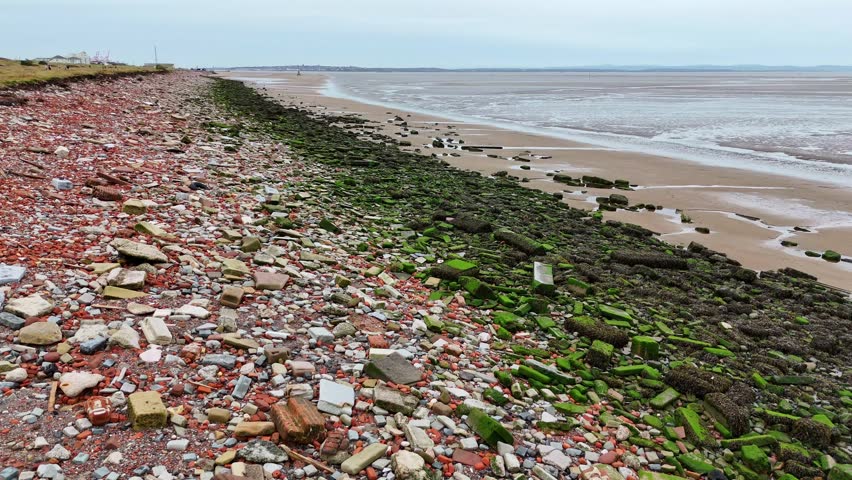 Aerial view of the Northern part of Crosby Beach near Liverpool featuring bricks and rubble from the remains of buildings in Liverpool bombed in the Blitz during WW2.