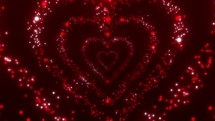 Red glowing heart spark animation on dark background. Ideal for Valentine’s Day, weddings, romantic slideshows, and love story projects.