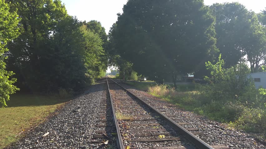 Peaceful Morning Walk Along Railroad Tracks Sunshine Rays and Birdsong