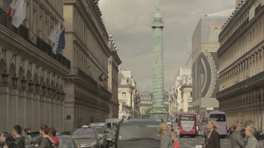 PARIS - CIRCA 2012 - Rue de la Paixa and the famous Vendôme square with a bus passing on foreground