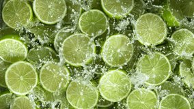 Super Slow Motion Shot of Fresh Limes Falling into Water at 1000 fps - Powered by Shutterstock - Get 15% off with code: PIKWIZARD15