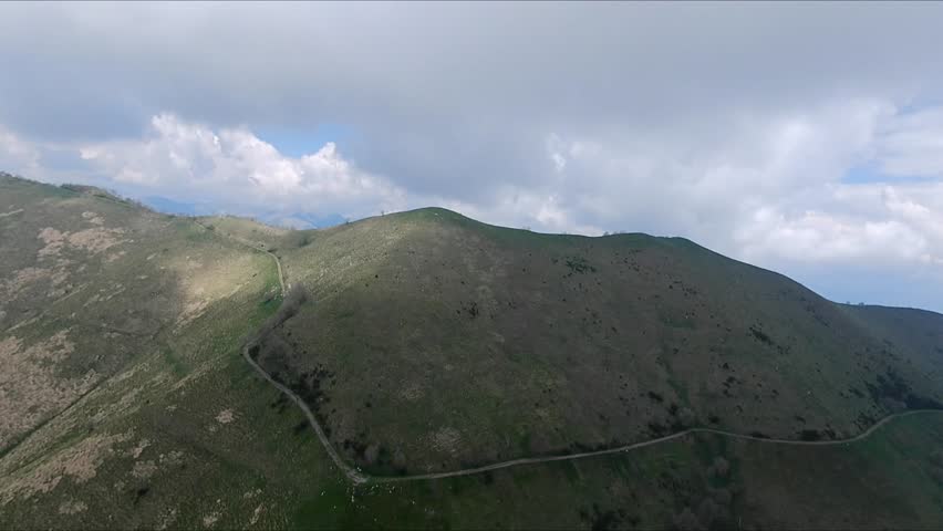 Aerial view of Monte San Primo peak with summit cross, overlooking Lake Como, Lecco, and Bellagio in Lombardy, Italy.