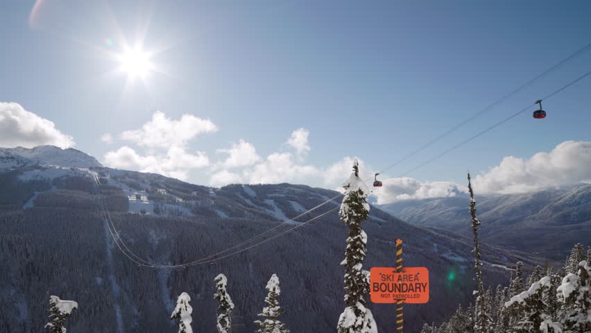 Whistler Mountain Peak2Peak gondola, ski mountain, sunny day, winter, ski hill. 4k 24fps