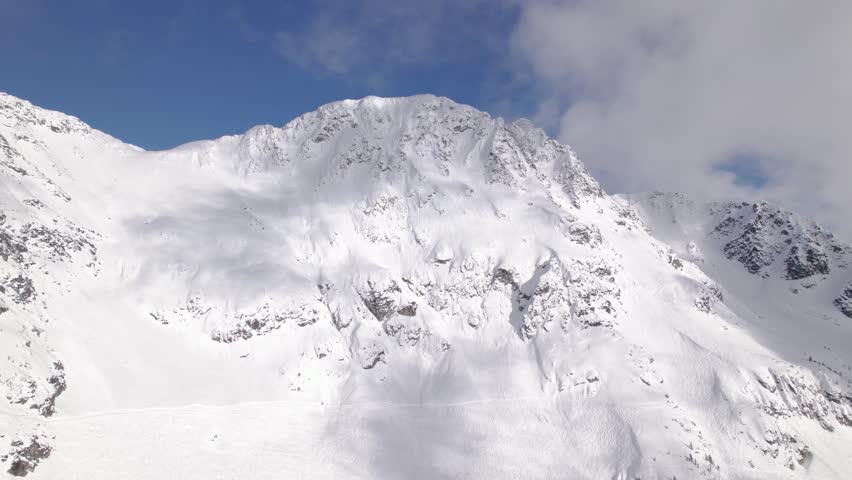 Blackcomb mountain peak, ski resort, snowy mountain peak, Whistler Blackcomb. 4K 24FPS