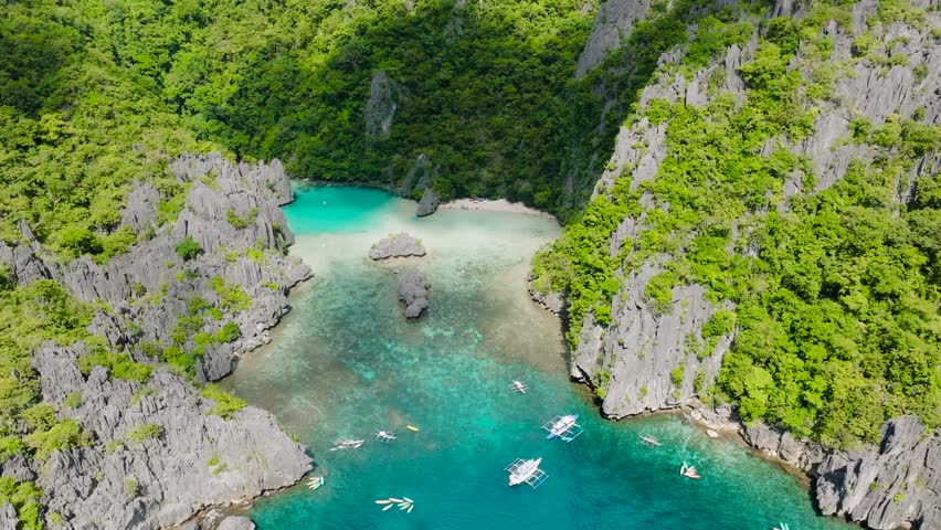 Beautiful limestone rock formations around the pristine lagoons. Cadlao Island. El Nido. Palawan, Philippines.