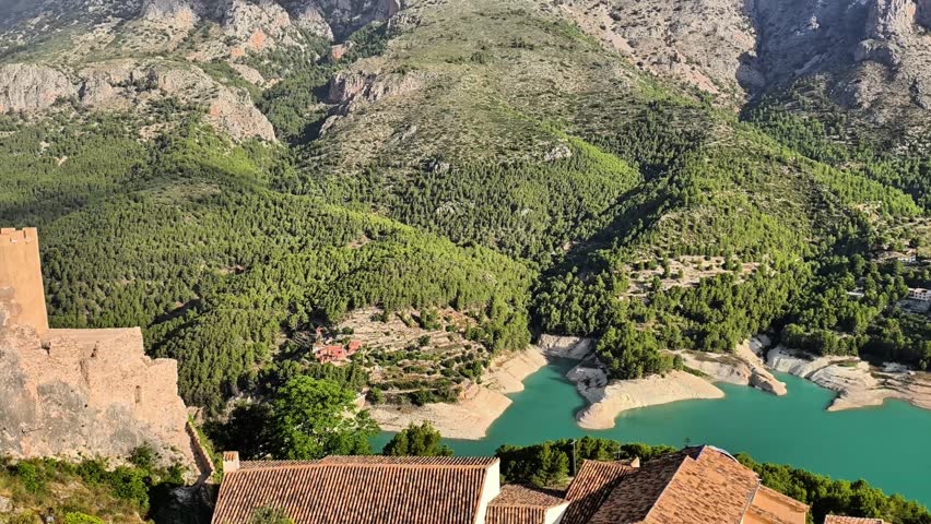 An absolutely breathtaking landscape showcases majestic mountains, vibrant lush greenery, and a tranquil serene lake