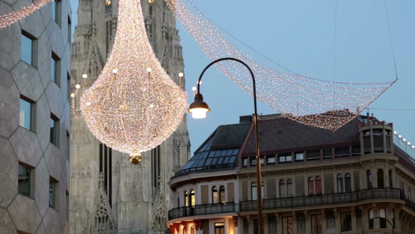 Christmas lights adorn the city streets of vienna, austria at dusk