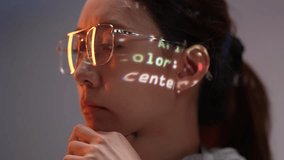 A female programmer concentrates on her computer screen, with code projected onto her face and glasses. This image represents a deep focus on software development and data. - Powered by Shutterstock - Get 15% off with code: PIKWIZARD15