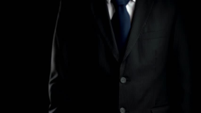 A businessman in a suit presents a digital cloud interface showcasing symbols for data management and secure access, representing modern technology and innovation concepts. Qubit - Powered by Shutterstock - Get 15% off with code: PIKWIZARD15