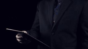 A businessman holds a tablet displaying a virtual AI interface filled with digital data analytics overlays, emphasizing technology and innovation in modern business. Qubit - Powered by Shutterstock - Get 15% off with code: PIKWIZARD15