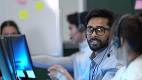 A diverse team of customer support agents works in a modern call center. Smiling operators assist clients over the phone, providing helpful and professional technical support. - Powered by Shutterstock - Get 15% off with code: PIKWIZARD15