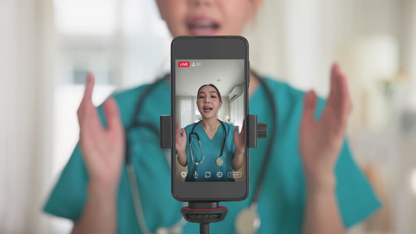 Young adult woman asia Gen Z people anti aging expert modern nurse live talk viral video selfie camera on mobile phone app mental health care. Online sharing digital virtual asian vlogger filming.