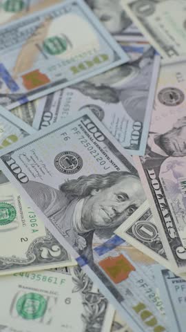 USA money, cash paper dollars, american business and financial transactions. Cash dollars in bills of different denominations as a conceptual background