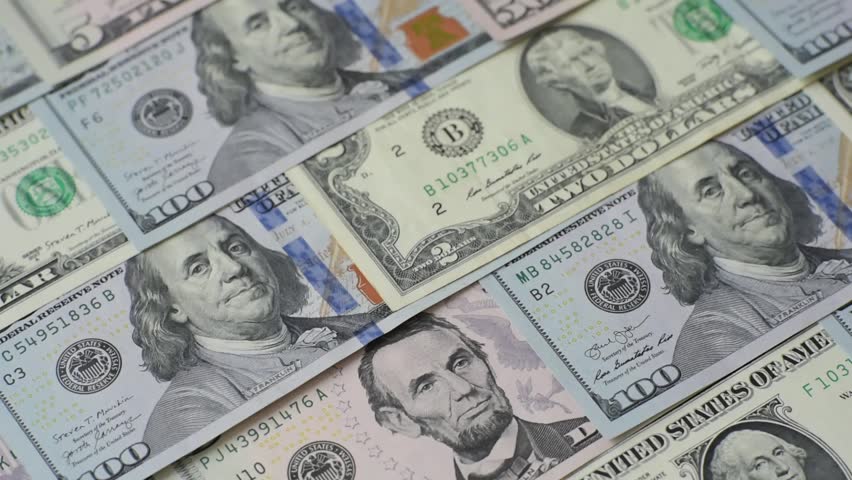 USA money, cash paper dollars, american business and financial transactions. Cash dollars in bills of different denominations as a conceptual background
