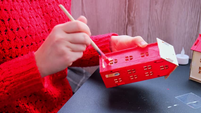 Sustainableminded Christmas cozy atmospheric festive decor in modern scandinavian home handmade decoration. Tutorial for making do it yourself craft wooden houses. Seasonal activity for kids