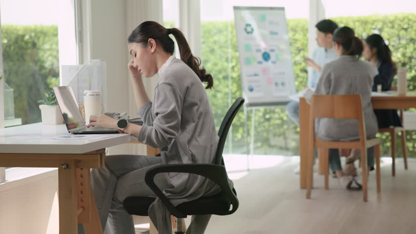Asia people young adult woman bad day work hard bored data tired at office desk workplace think worry job tough stress asian workforce issue. Mid life crisis mental health illness sad labor effort.