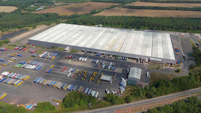 Wide aerial drone view of warehouse complex and business district near Sherwood Forest Nottingham England UK