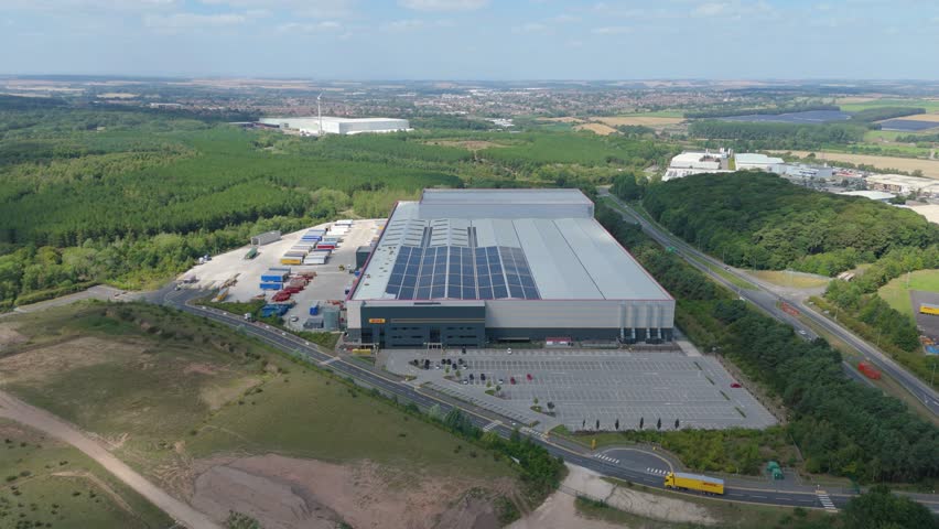Drone aerial view of business park and warehouses next to Sherwood Forest Nottingham England UK