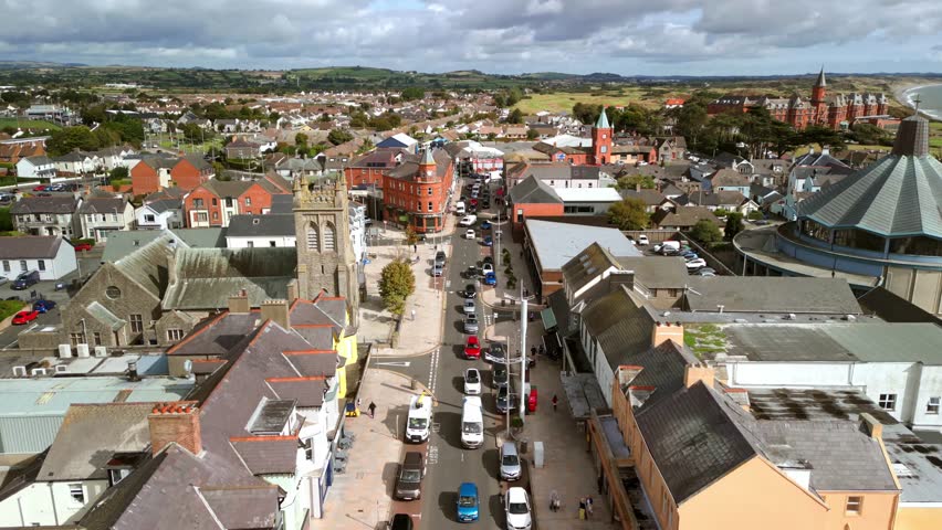 Travelling aerial video of Main Street in Newcastle, County Down, Northern Ireland. Produced in 4K, 60FPS and with Rec709 color.