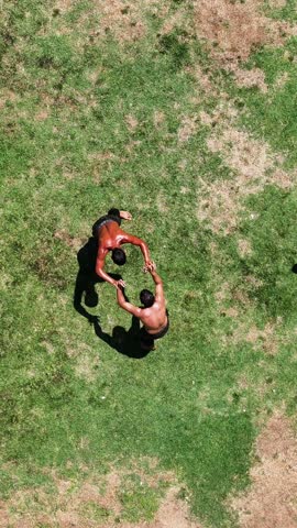 Wrestlers doing oil wrestling - 4K vertical video of wrestlers doing traditional Turkish oil wrestling