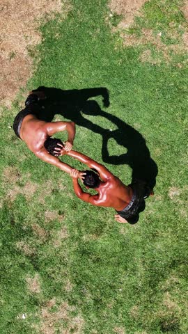 Wrestlers doing oil wrestling - 4K vertical video of wrestlers doing traditional Turkish oil wrestling