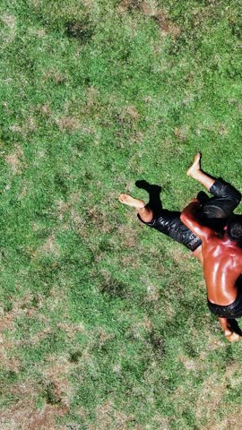 Wrestlers doing oil wrestling - 4K vertical video of wrestlers doing traditional Turkish oil wrestling