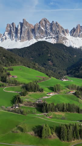 Spring landscape with Santa Magdalena village, Italian Dolomites Alps, in South Tyrol, Val di Funes, Italy. Vertical video