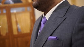 Close-Up Elegant Young Man Adjusting Bow Tie and Suit – Groom and Business Concept - Powered by Shutterstock - Get 15% off with code: PIKWIZARD15