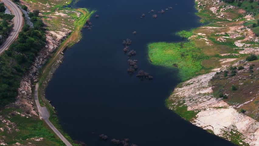 Lake Kaweah Shore with Road and Rocky Coast Drone View