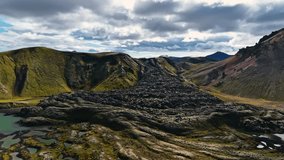 A lava flow - stream of molten rock, or magma, erupted from a volcano's vent creating mountain in Iceland - Powered by Shutterstock - Get 15% off with code: PIKWIZARD15