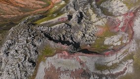 Aerial drone view of rugged lava formations in Iceland with vibrant volcanic textures and dramatic rocky terrain. - Powered by Shutterstock - Get 15% off with code: PIKWIZARD15