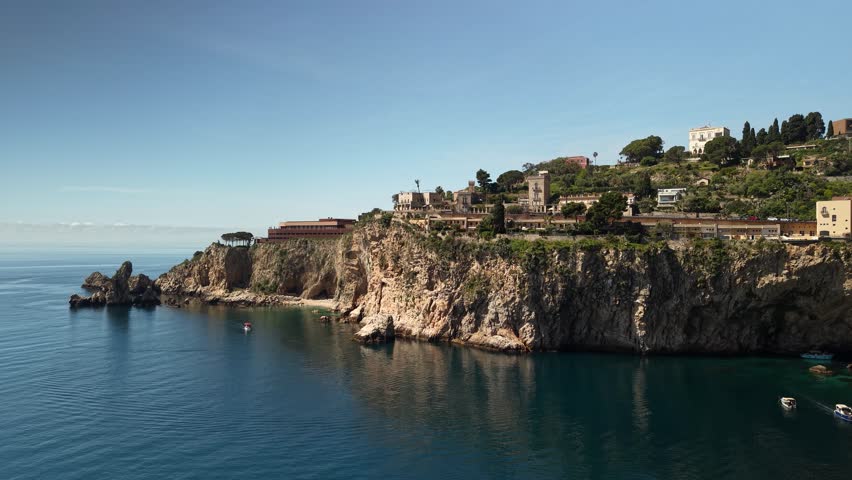 Isola Belle Sicily aerial view rising towards the stunning island reveals mount Etna on the horizon