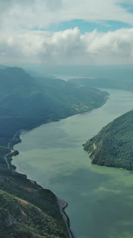 Aerial view on the Danube river and mountains in Djerdap National Park, Serbia Romania border. Vertical video 4k
