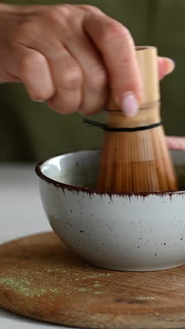 Woman Whisks Matcha Tea With Water