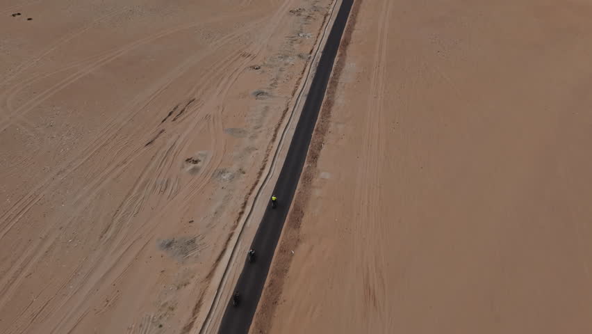 Motorcycles Riding on Desert Mountain Road