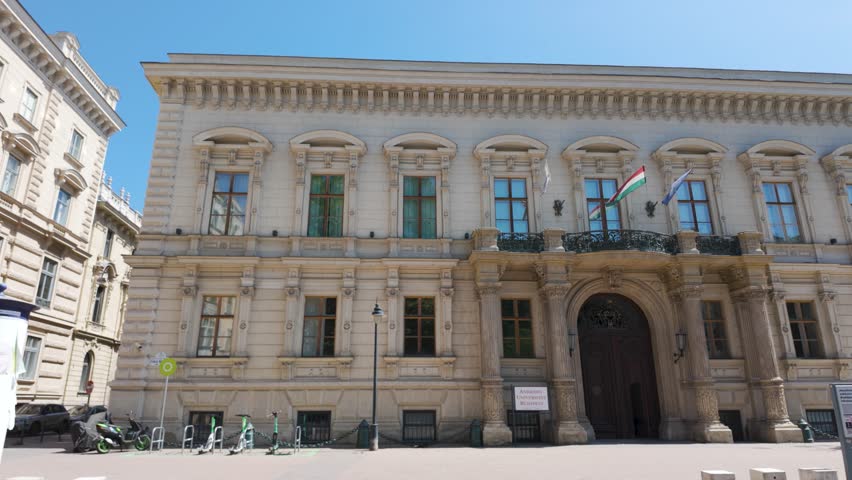 Neoclassical exterior of Andrássy University in Budapest, emphasizing its monumental architecture, decorative elements, and academic heritage
