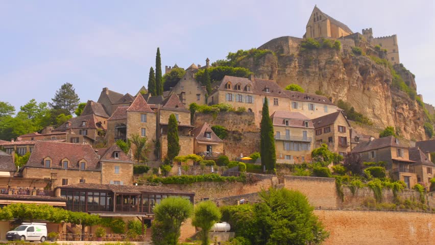 Explore the charming village of Beynac in France, featuring stunning medieval architecture, lush greenery, and rich history. Experience the serene atmosphere combined with breathtaking views.