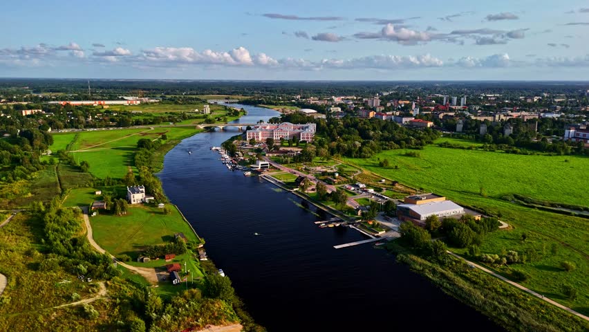 Jelgava Castle on the Lielupe River shore in Latvia viewed from aerial perspective