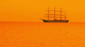 Sailing Ship Silhouette at Sunset on Orange Sea - Powered by Shutterstock - Get 15% off with code: PIKWIZARD15