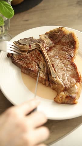 T-bone steak roast cut of meat juicy roast beef tasty snack fresh gourmet food background on the table rustic food top view copy space