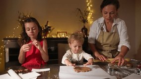 Family Baking Christmas Cookies Together in a Festive Holiday Atmosphere - Powered by Shutterstock - Get 15% off with code: PIKWIZARD15