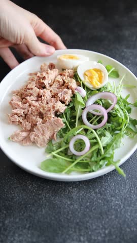 Tuna salad egg, arugula, vegetables tasty snack fresh delicious gourmet food background on the table rustic food top view copy space keto and paleo diet pescetarian diet