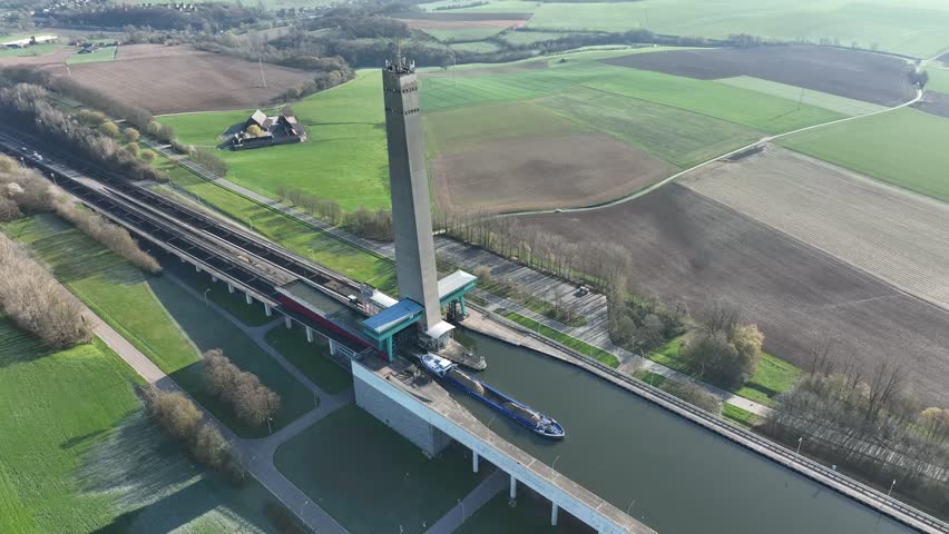 Drone semi orbit showing the Ronquieres ship lift and canal in Belgium, highlighting the engineering marvel and surrounding area.