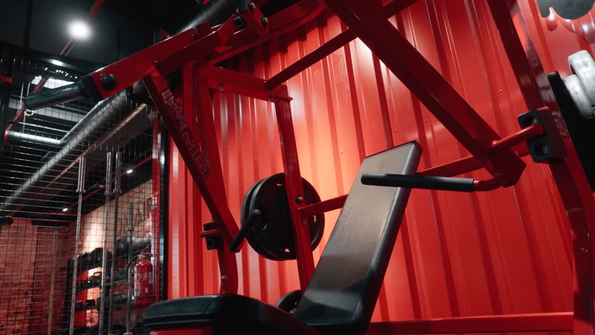 athlete preparing gym machine with towel before training